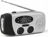 A silver and black emergency radio with a flashlight and antenna, shown against a white background. Produktbild-Vorschau