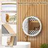 A round LED mirror with a gold frame and a leather strap hangs above a sink in a bathroom with wood-paneled walls. The mirror reflects a shelf with bottles and decorative tiles. Insets on the left highlight features like the mirror's safety, reflection qua Anteprima dell’immagine prodotto