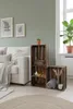 Living room with a sofa, wooden crates used as shelving, and plants. Anteprima dell’immagine prodotto