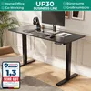 A black standing desk with a computer monitor, keyboard, headphones, and a coffee cup. Produktbild-Vorschau