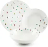 A set of white porcelain plates and bowls with a pattern of skiers and Christmas trees. Anteprima dell’immagine prodotto