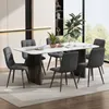 A dining room scene with a table and chairs set up for a meal. Náhled obrázku produktu