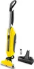 A yellow and gray floor cleaner with accessories on a white background. Anteprima dell’immagine prodotto
