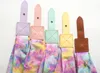 A close-up overhead view of five tie-dye straps with leather attachments. Produktbild-Vorschau