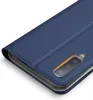 A close-up view of a blue flip case for a smartphone, showing the camera cutout. Anteprima dell’immagine prodotto
