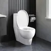 A white toilet with the lid up, set against a dark, slatted wall and a gray floor. A roll of toilet paper is mounted on the wall. Produktbild-Vorschau