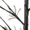Close-up view of a decorative LED tree with black branches and small, warm white lights. Náhled obrázku produktu