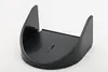 A black plastic accessory for a coffee machine, likely a cup holder or stand, is shown against a white background. Produktbild-Vorschau