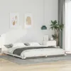A bedroom scene with a bed frame and bedding. Produktbild-Vorschau