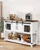 A farmhouse-style coffee bar cabinet with sliding barn doors and open shelving, decorated with coffee-related items and beverages. Anteprima dell’immagine prodotto