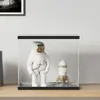 A display box containing an astronaut figurine and a rocket figurine. Náhled obrázku produktu