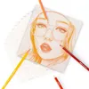 A drawing of a woman's face with colored pencils on a white background. Produktbild-Vorschau