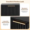 Close-up shots of a black nightstand with gold hardware, highlighting its features. Produktbild-Vorschau