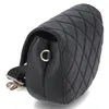 A black quilted handbag is shown from a side angle against a white background. Anteprima dell’immagine prodotto