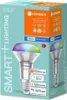 The image shows the packaging of a smart LED light bulb. The packaging is predominantly light blue with orange accents and features an illustration of the light bulb itself, displaying a multicolor light. Produktbild-Vorschau