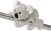 A plush koala toy is clinging to a metal bar. Anteprima dell’immagine prodotto