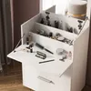 A white makeup vanity with its top open, revealing compartments filled with various makeup and beauty products. Náhľad obrázku produktu