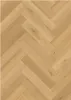 A close-up, top-down view of a herringbone-patterned vinyl flooring. Produktbild-Vorschau
