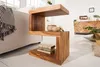 A wooden side table with books and baskets on it, placed next to a sofa in a living room. Produktbild-Vorschau