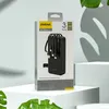 A product box for a power bank is displayed on a white pedestal, with green leaves in the foreground and a shadow of leaves on the background. Produktbild-Vorschau