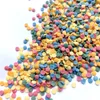 A pile of colorful sprinkles on a white background. Produktbild-Vorschau