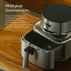 A silver air fryer is placed on a wooden cutting board, with text overlay describing its features. Produktbild-Vorschau