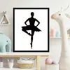 A framed black silhouette of a ballerina is displayed on a white background, placed on a shelf with children's decor. Anteprima dell’immagine prodotto