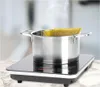 A pot of spaghetti is being cooked on an induction cooktop. Podgląd zdjęcia produktu