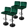 Four green velvet bar stools with black bases are arranged on a white background. Podgląd zdjęcia produktu