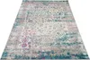 A rectangular rug with a distressed, vintage-inspired pattern in shades of blue, cream, pink, and gray, laid out on a white background. Náhľad obrázku produktu