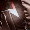 A close-up view of the interior of a backpack, showing fabric textures, a zipper, and a white insert. Náhľad obrázku produktu