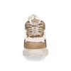 A front view of a beige and brown Buffalo sneaker with white fluffy trim. Podgląd zdjęcia produktu