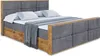 A bed with a headboard and footboard, made of upholstered fabric and wood, with pillows and a blanket on top. Produktbild-Vorschau