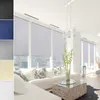 A collage of fabric swatches and a living room scene with large windows and roller blinds. Anteprima dell’immagine prodotto