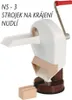 A white and brown manual noodle and vegetable cutter with a red handle is shown against a white background. A small wooden block is placed in front of the cutter. Produktbild-Vorschau