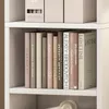 A bookshelf filled with books. Náhľad obrázku produktu