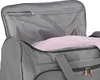 Close-up view of the interior of a gray travel bag, showing a mesh pocket and a pink towel. Náhľad obrázku produktu