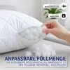 A hand is shown adjusting the filling of a white quilted pillow through an open zipper. Produktbild-Vorschau