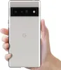 A hand holding a silver Google Pixel 6 Pro phone. Produktbild-Vorschau