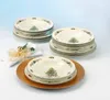 A set of Christmas-themed soup bowls is displayed on a table setting. Produktbild-Vorschau