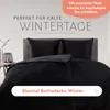 A bed with black bedding, styled for a winter theme. Anteprima dell’immagine prodotto