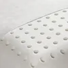 A close-up view of a white pillow with a textured fabric and a pattern of circular indentations. Produktbild-Vorschau