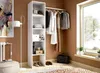 A room with a white open wardrobe structure, clothes hanging on a rail, and various items on shelves. Produktbild-Vorschau
