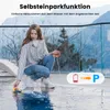 A woman is kneeling by a pool, holding a remote control for a pool robot, which is in the water. Anteprima dell’immagine prodotto