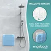A shower head and a blue shower mat are shown on a tiled wall, with marketing text and graphics on the right side. Produktbild-Vorschau