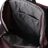 Close-up view of the interior of a burgundy backpack. Produktbild-Vorschau