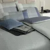A neatly arranged bed with JOOP! branded bedding and accessories. Produktbild-Vorschau