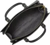 An overhead view of an open black Michael Kors handbag. Produktbild-Vorschau