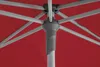 Close-up view of the internal mechanism and fabric of a red umbrella. Produktbild-Vorschau
