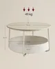 A round coffee table with a built-in fabric basket, featuring measurement indicators. Náhled obrázku produktu